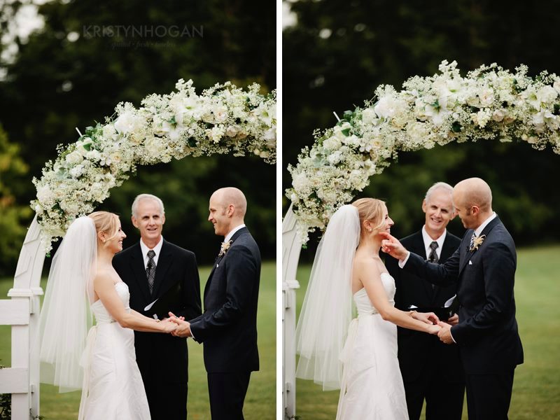Ralph officiating at Cedarwood Mansion under a white flower arch